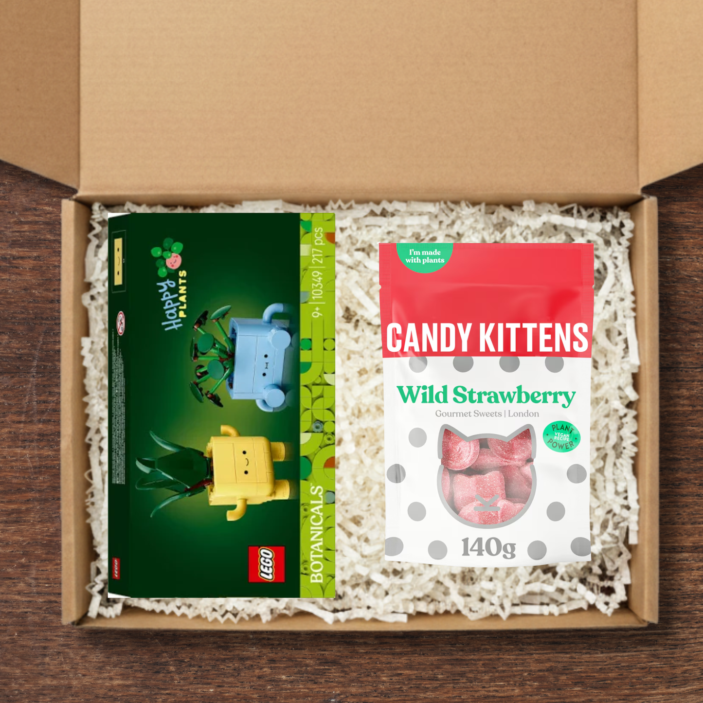 Gift box containing a LEGO Botanicals happy plants, and Candy Kittens Wild Strawberry sweets