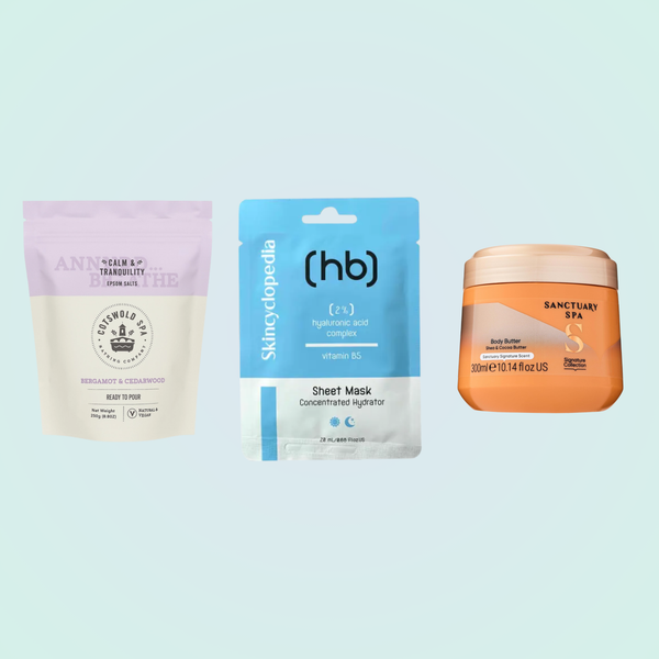 A collection of Cotswold Bath Salts, Skincyclopedia Hyaluronic Acid Sheet Mask, and Sanctuary Spa Body Butter