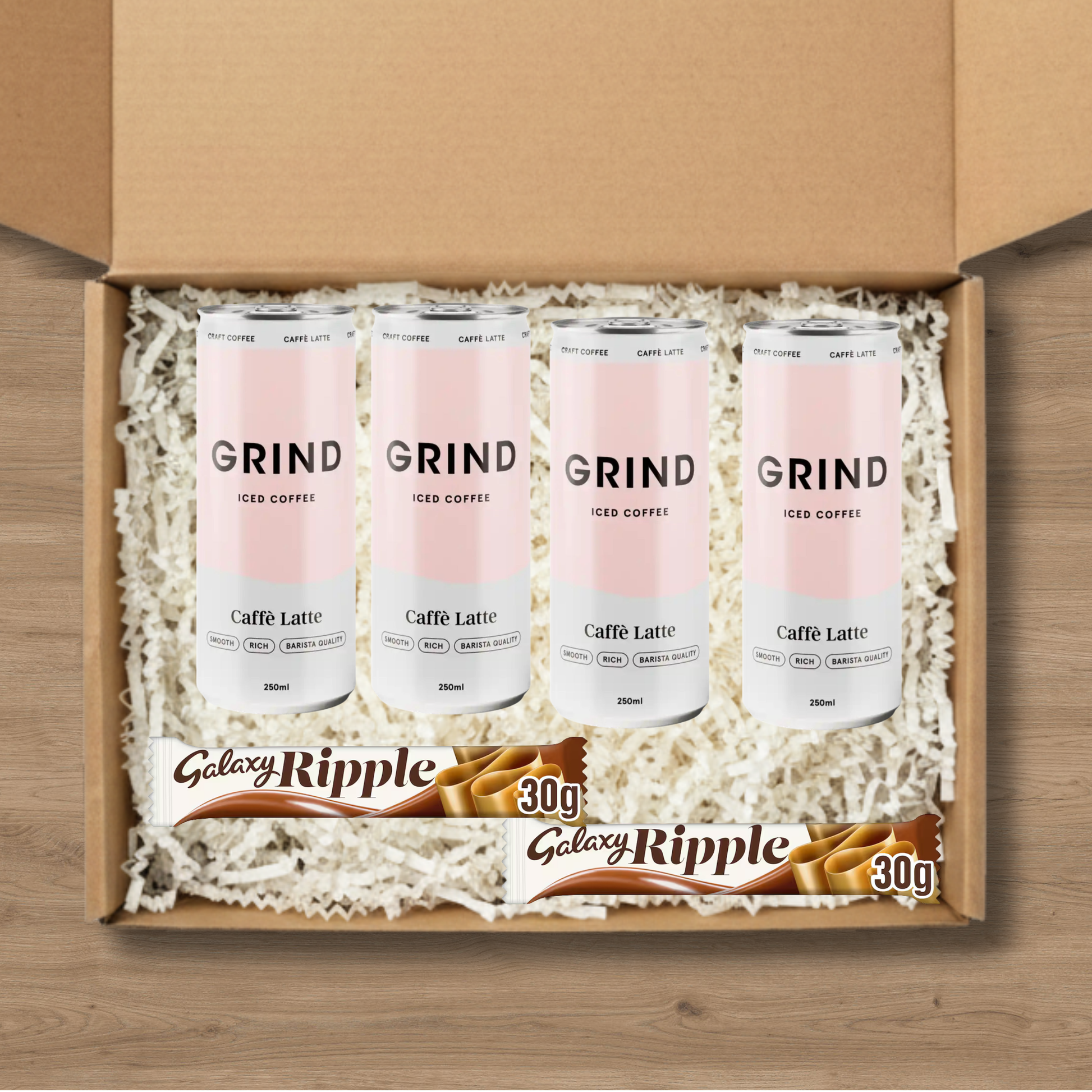 4 cans of Grind Caffe Latte Iced Coffee and 2 Galaxy Ripple chocolate bars