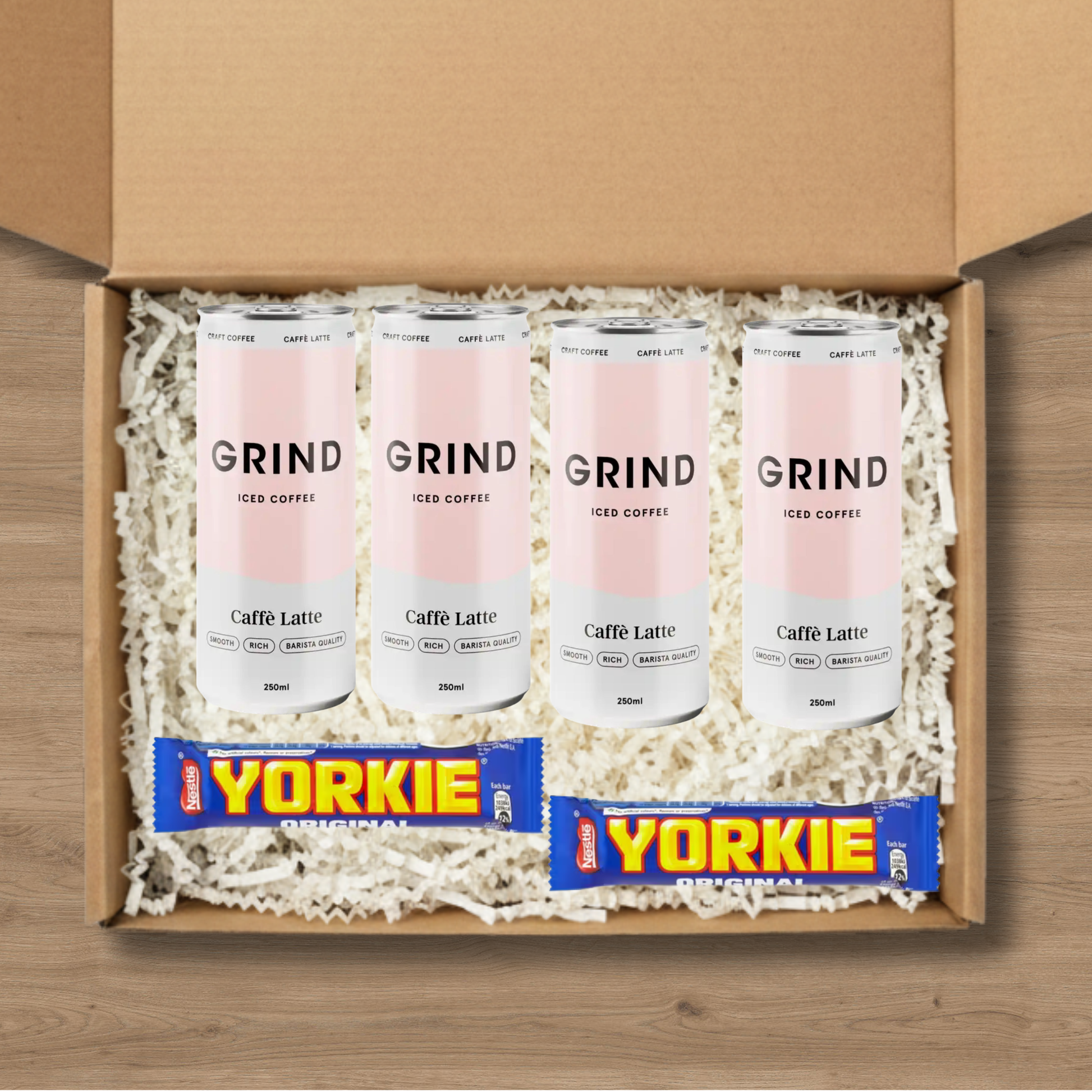 4 cans of Grind Caffe Latte Iced Coffee and 2 Yorkie chocolate bars