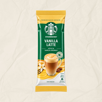 A single packet of Starbucks Vanilla Latte instant coffee, featuring its signature green and yellow packaging with a graphic of a vanilla-flavored latte, set against a textured beige background.
