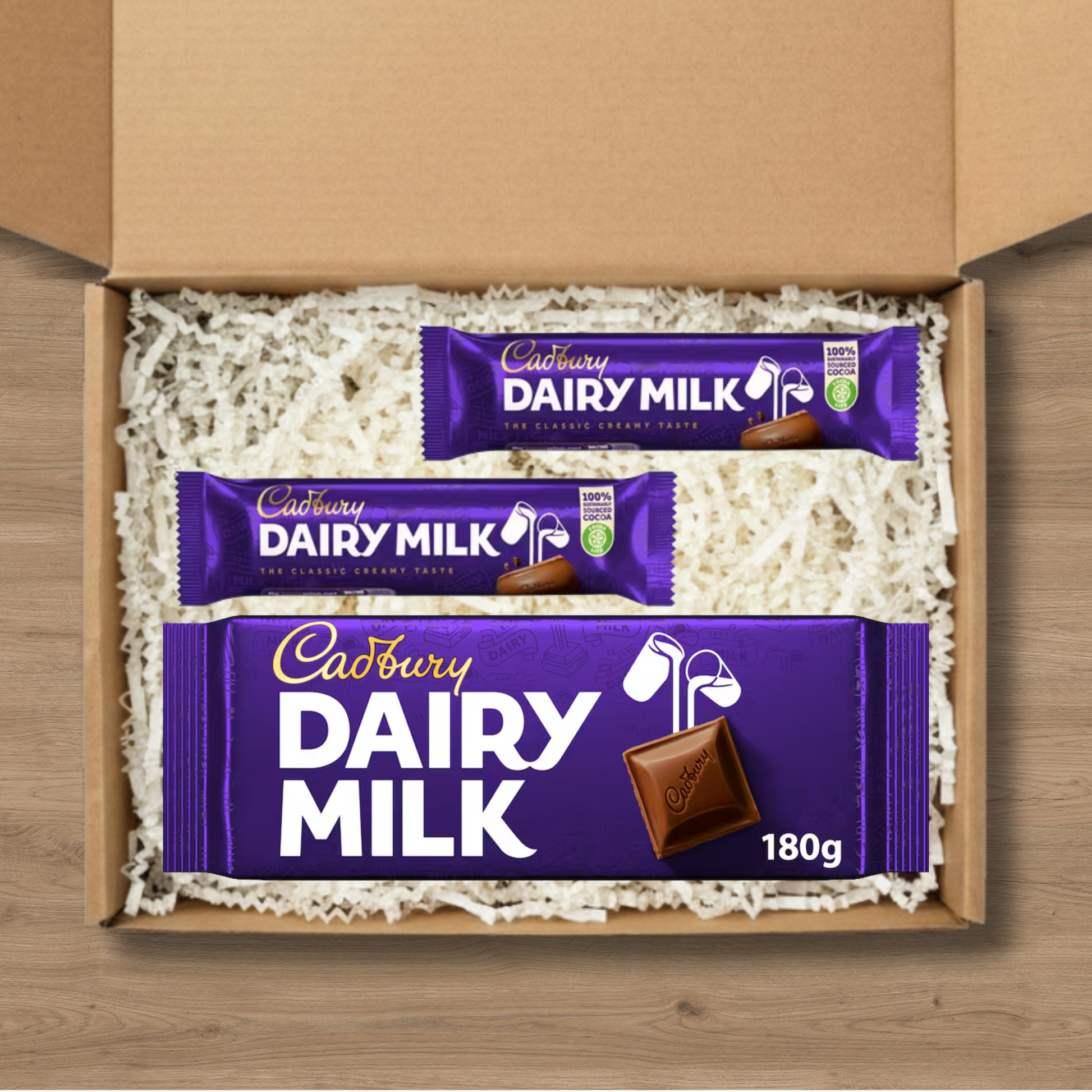 Small Cadbury Dairy Milk gift box with two small bars and a 180g sharing bar