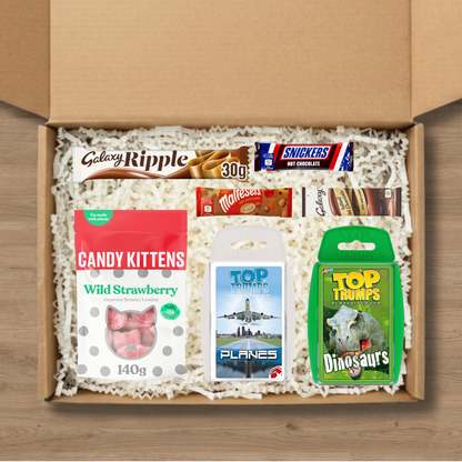 Gift set containing two Top Trumps quiz games, a Galaxy Ripple chocolate bar, candy kittens sweets, and celebrations hot chocolates
