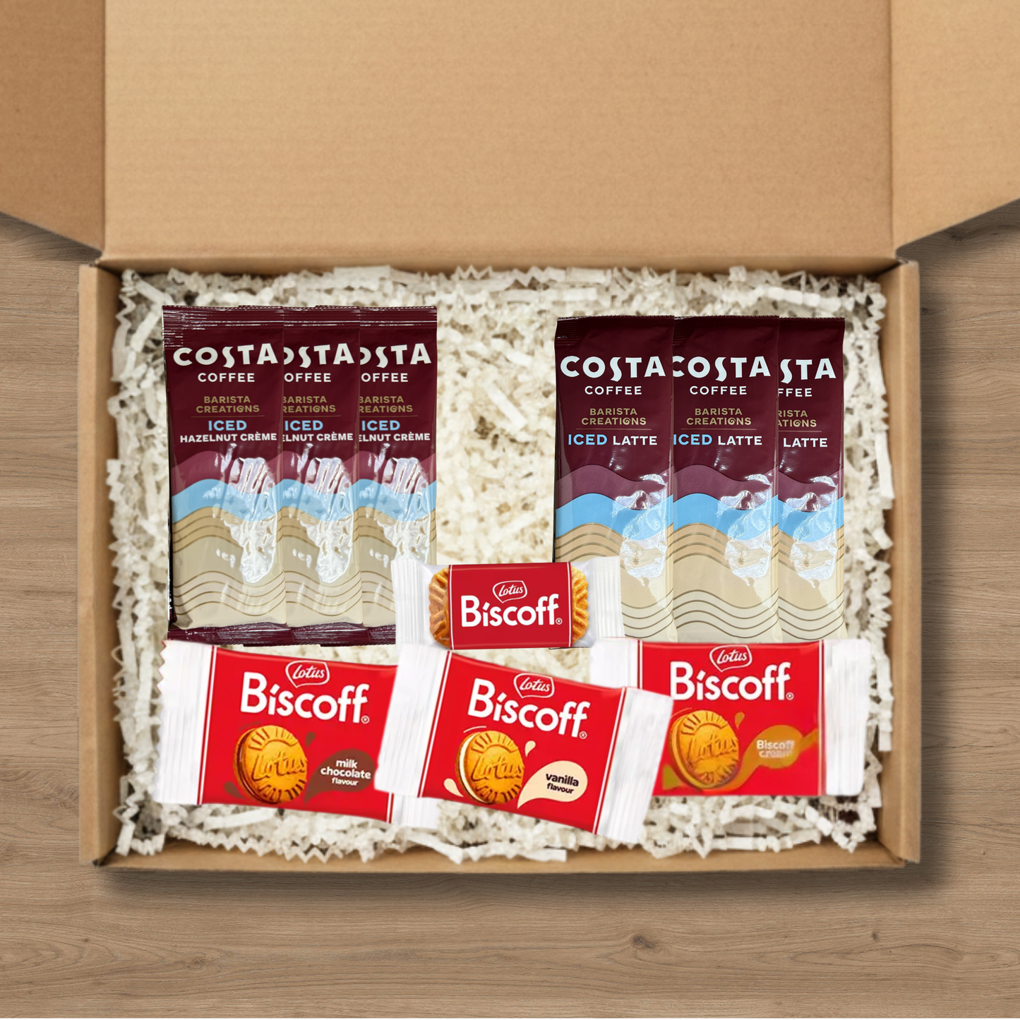 Gift box including 3x Costa Coffee Iced Latte Coffee Sachets, 3x Costa Coffee Hazelnut Creme Iced Coffee Sachets, 1x Lotus Biscoff biscuits, 1x Lotus Biscoff Milk Chocolate Cream, 1x Lotus Biscoff Cream, and 1x Lotus Biscoff Vanilla Cream
