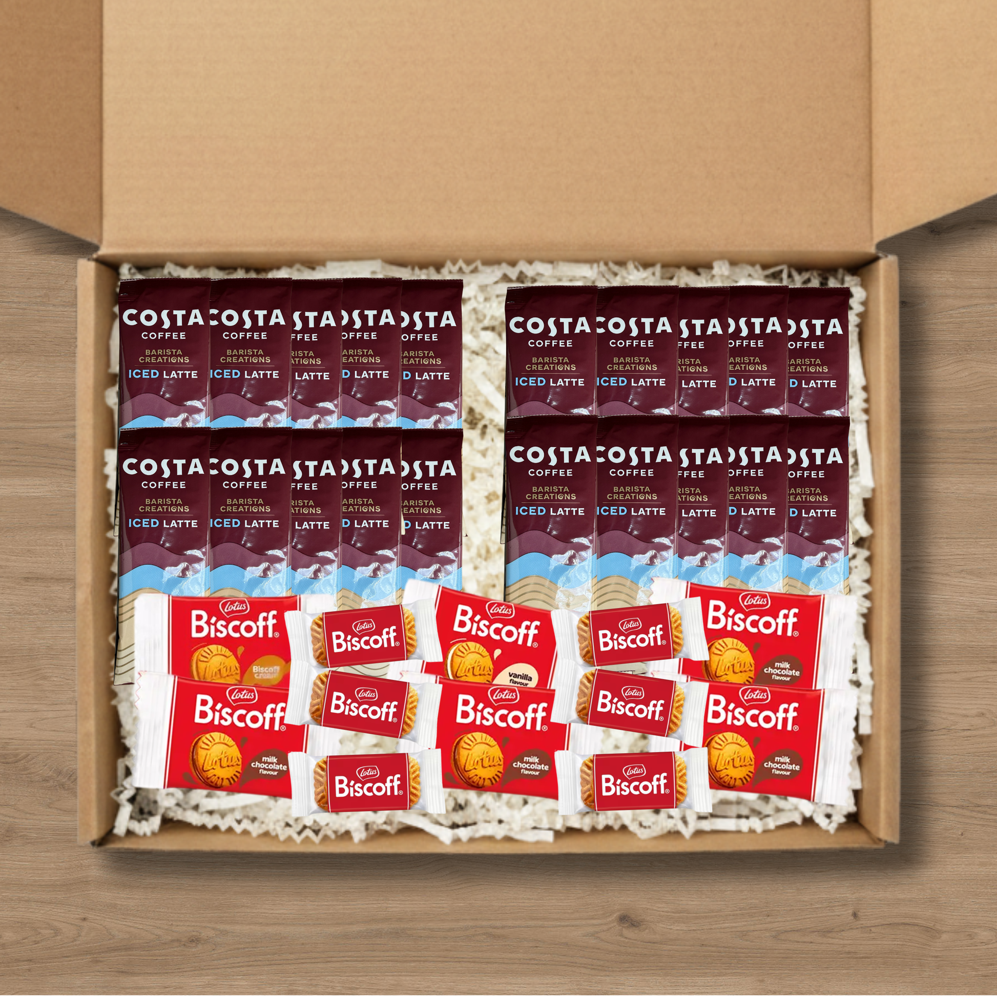 A gift box containing 20 costa coffee iced latte sachets, 6 packs of lotus biscoff biscuits and 2 packs each of lotus biscoff cream, biscoff vanilla cream, and biscoff milk chocolate cream biscuits