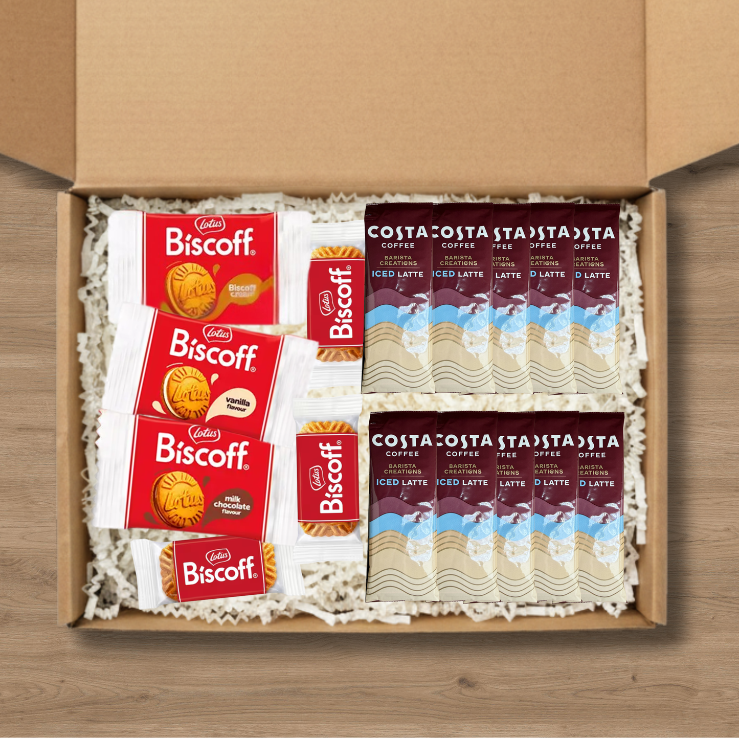 A gift box containing 10 costa coffee iced latte sachets, 3 packs of lotus biscoff biscuits and 1 pack each of lotus biscoff cream, biscoff vanilla cream, and biscoff milk chocolate cream biscuits