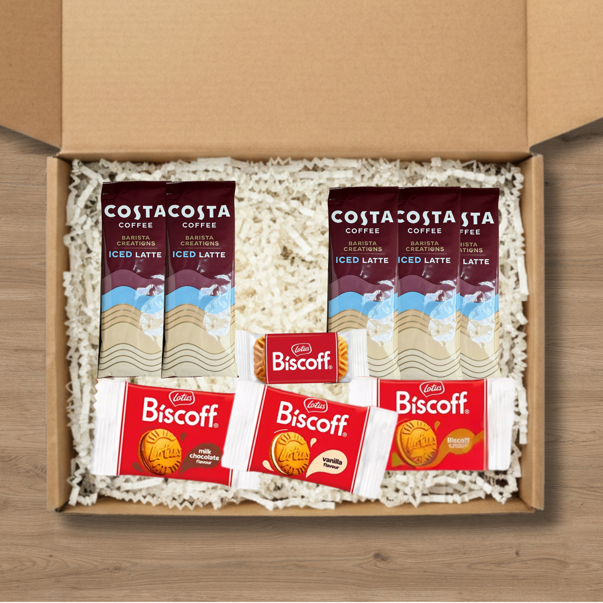 A gift box containing 5 costa coffee iced latte sachets, 1 pack of lotus biscoff biscuits and 1 pack each of lotus biscoff cream, biscoff vanilla cream, and biscoff milk chocolate cream biscuits
