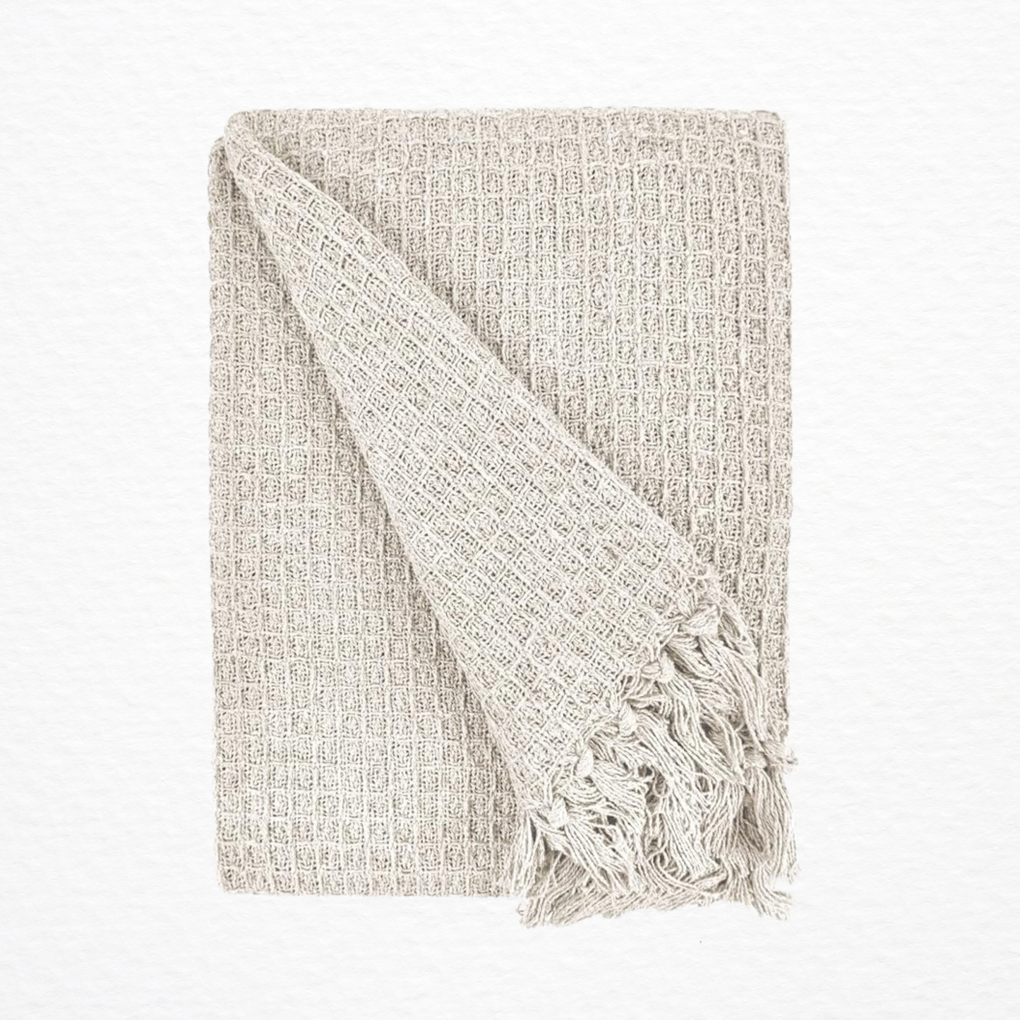 An Emma Barclay Honeycomb Throw folded over itself