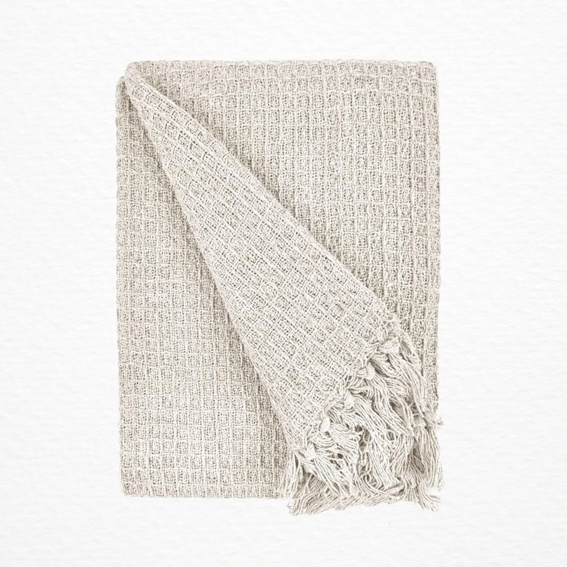 An Emma Barclay Honeycomb Throw folded over itself
