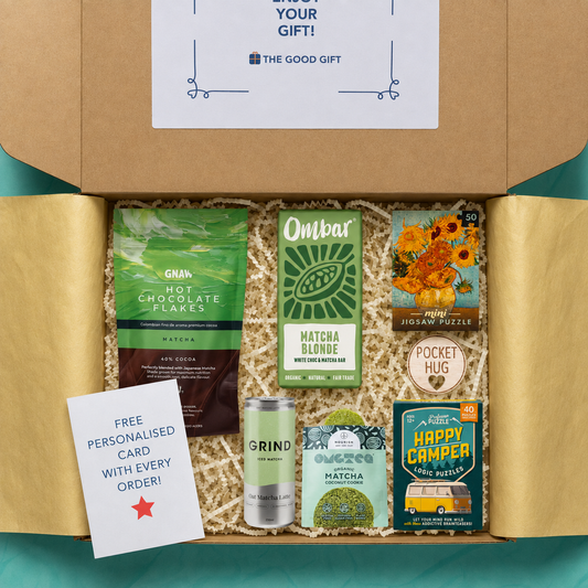 Gift box containing Ombar Matcha Blonde chocolate bar, GNAW matcha hot chocolate flakes, a matcha cokie, a grind matcha cookie, activities, and a pocket hug