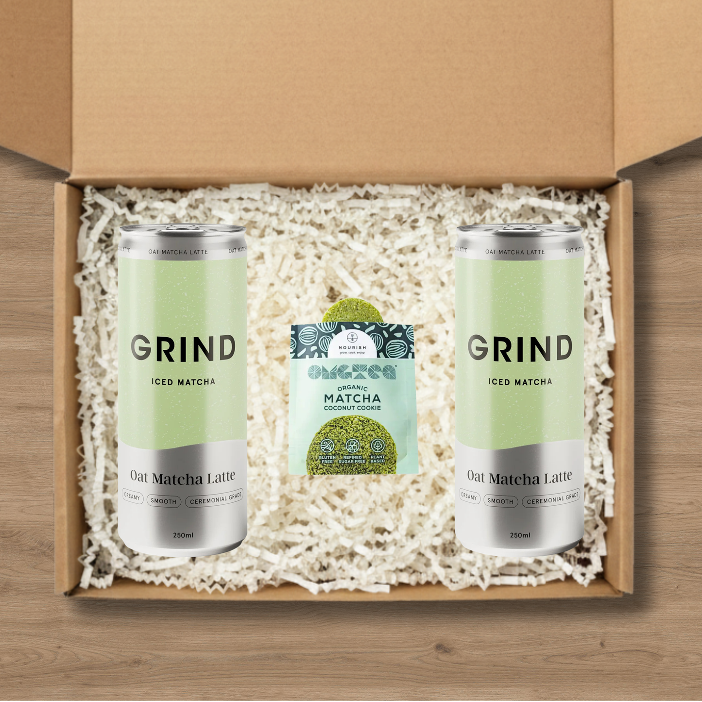 2 cans of Grind Iced Matcha and a matcha cookie