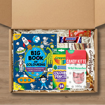 Gift set containing a 'Big Book of Colouring' book, Crayola colour pencils, candy kittens sweets, a galaxy ripple chocolate bar, and celebrations hot chocolate sachets.