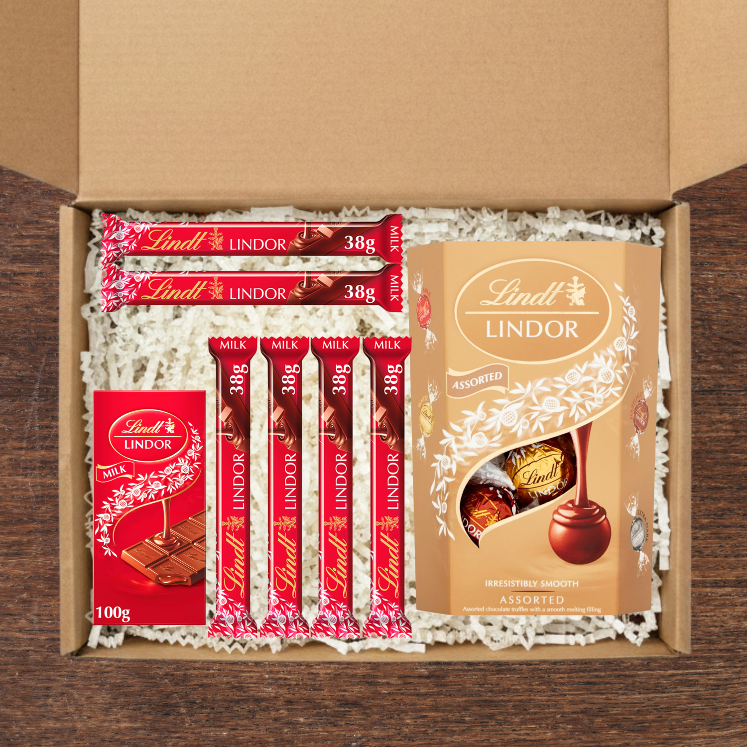Gift box containing Lindt lindor cornets, lindt lindor chocolate bar and lindt lindor mini chocolate bars