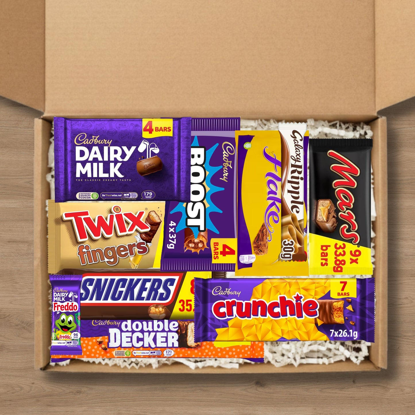 Gift box containing chocolate bars: Cadbury dairy milk, twix, boost, flake, galaxy ripple, mars, snickers, crunchie, double decker, and fredo