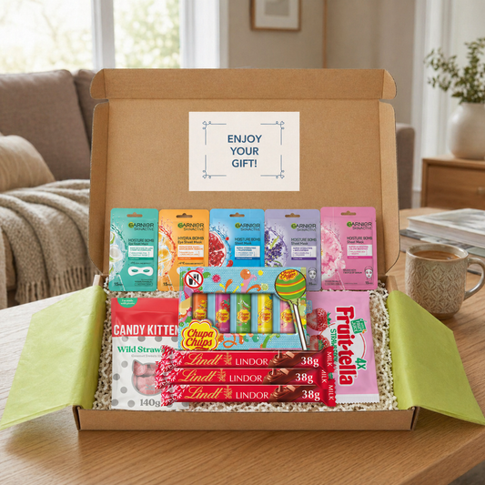 Gift box containing fruit-tella, Lindt Lindor chocolates, chupa chups lip balm, candy kitten sweets, and garnier skinactive face masks