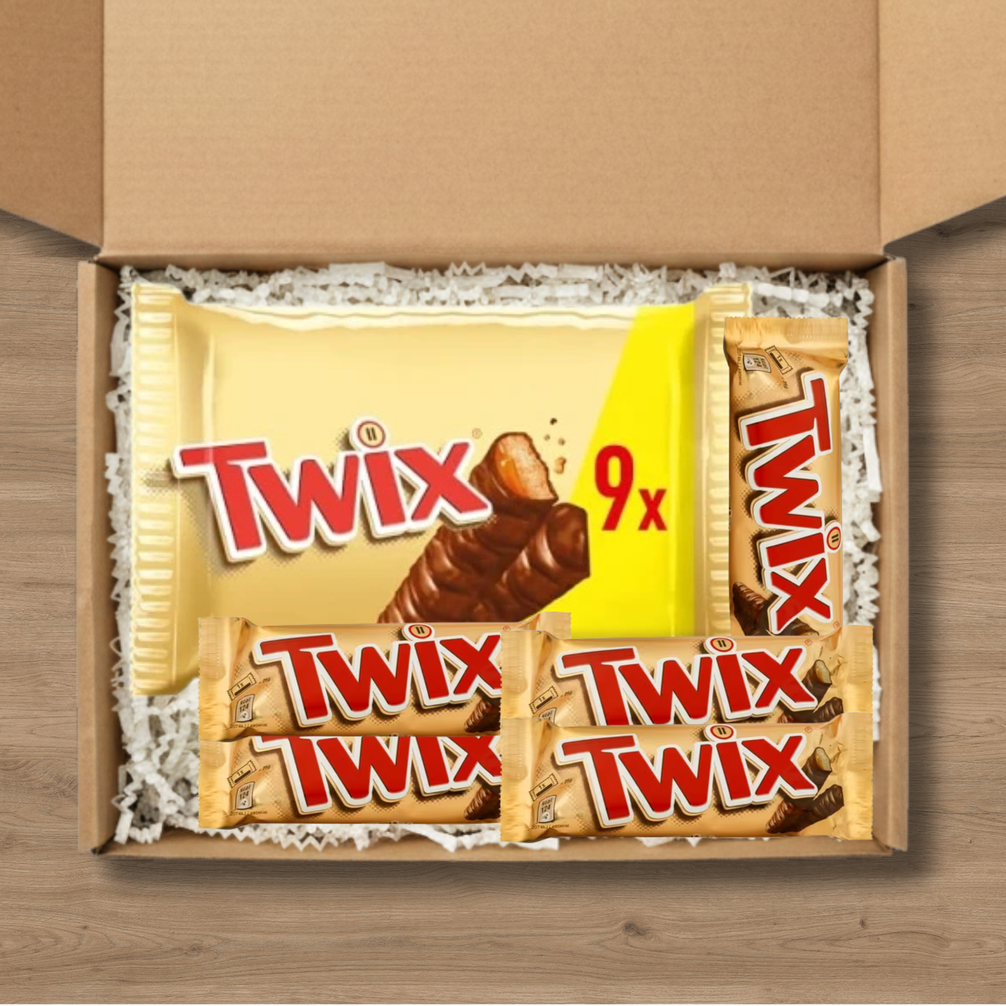 A gift box containing 5 Twix chocolate bars and a 9-pack of Twix chocolate bars