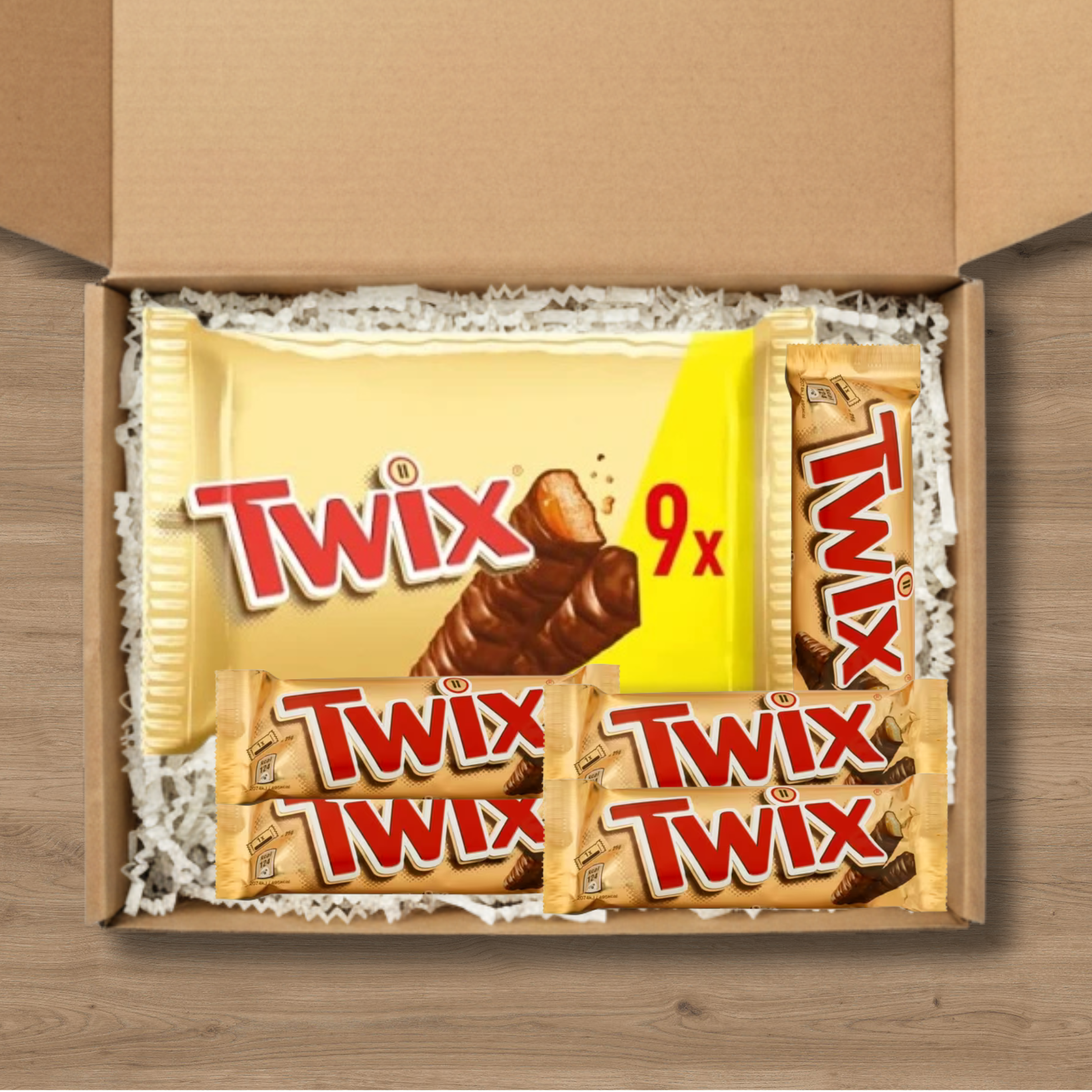 A gift box containing 5 Twix chocolate bars and a 9-pack of Twix chocolate bars