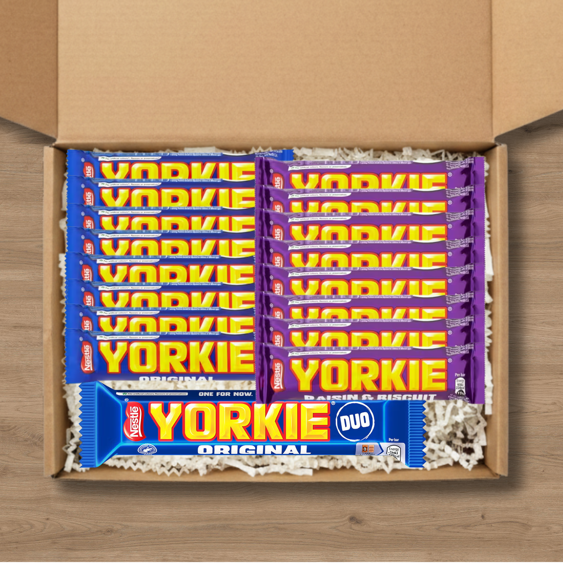 A gift box containing 8 Yorkie Original chocolate bars, 8 Yorkie Raisin & Biscuit chocolate bars, and a Yorkie Duo Original chocolate bar