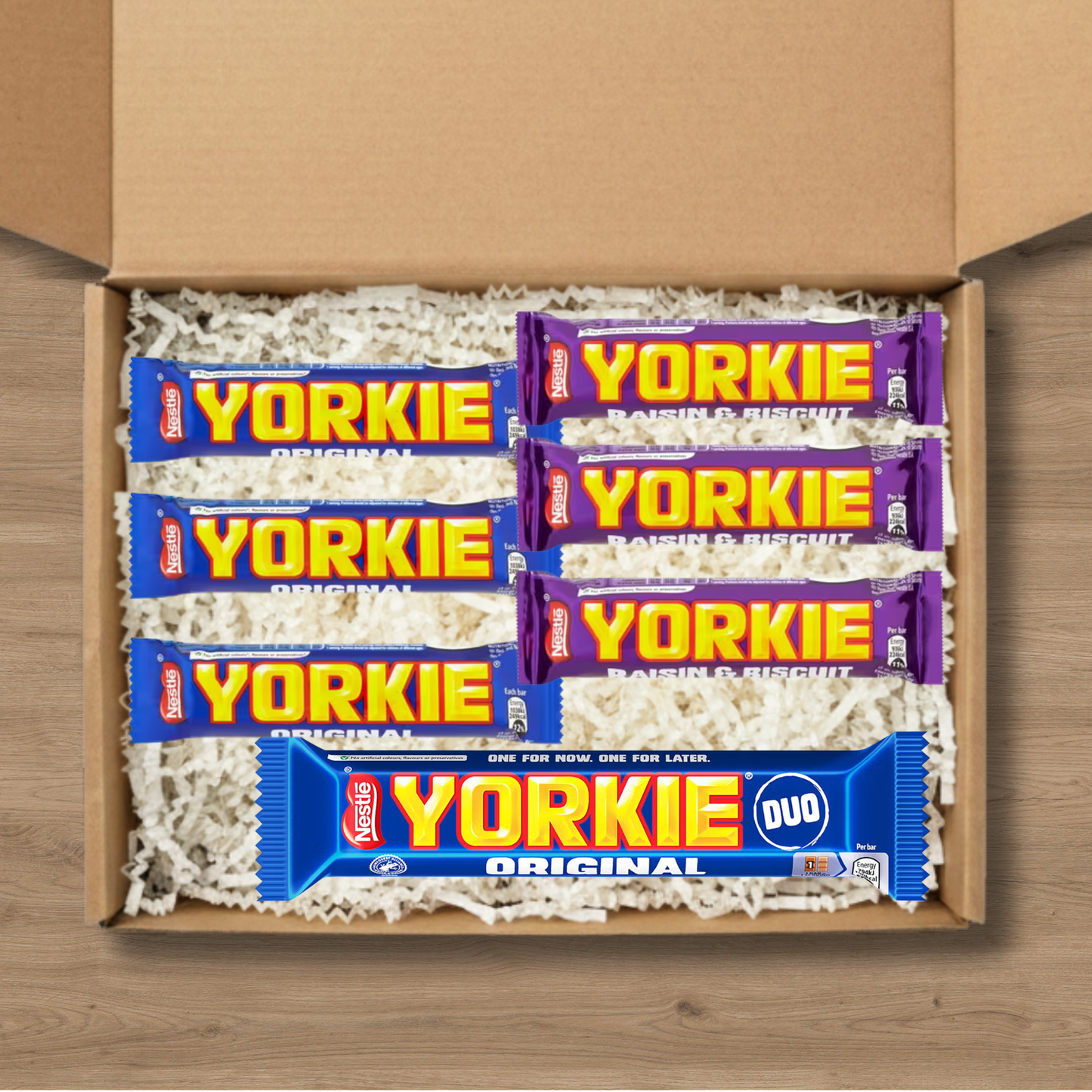 A gift box containing 3 Yorkie Original chocolate bars, 3 Yorkie Raisin & Biscuit chocolate bars, and a Yorkie Duo Original chocolate bar